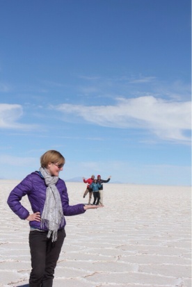 Allison Holding Isaiah, Eve & Marvin in the Palm of her Hand at Uyuni Salt Flats